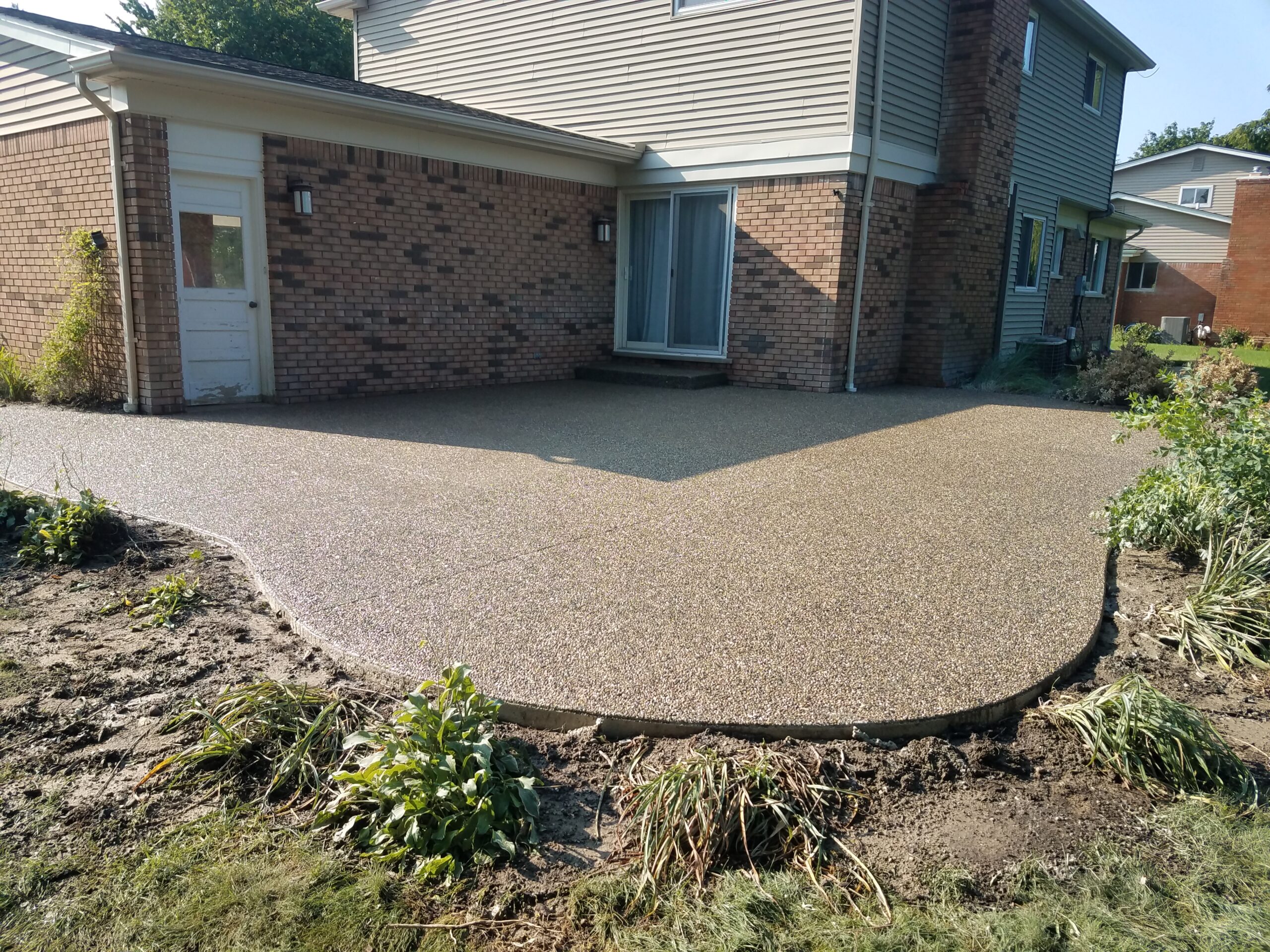 Stamped Concrete vs. Exposed Aggregate Concrete: Which Is Better for Your Home in Oakland County, MI?
